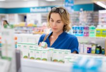 Woman choosing product in pharmacy